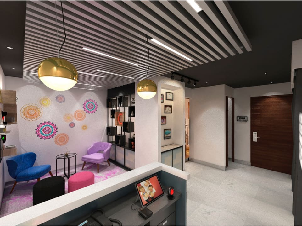 Boutique cinema lounge with a dark linear timber-slat ceiling, recessed LED strips and brass dome pendants over a jewel-toned velvet seating area, a decorative mandala feature wall, pink rug and ottomans, open black display shelving, and large-format grey marble flooring leading to a curved host desk.